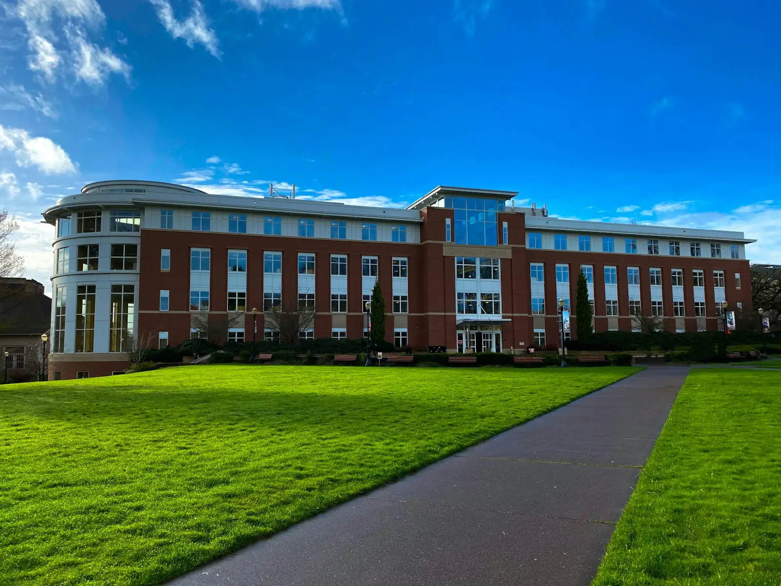 Red-brick academic hall on a sunny day