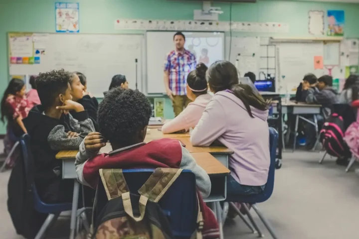 Teacher with students in a classroom