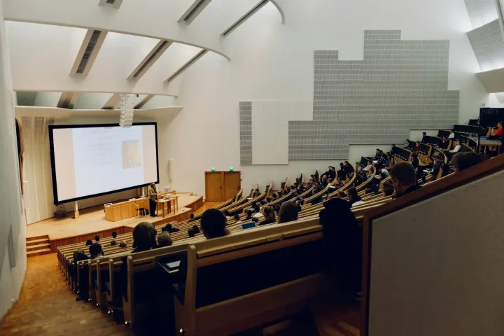 Students in a tiered lecture hall