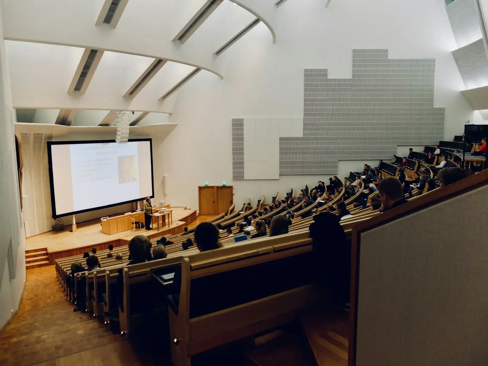 Students in a tiered lecture hall