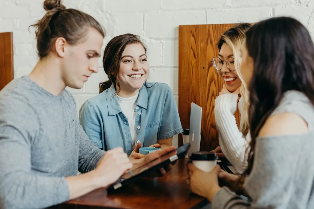 Students talking at a café table